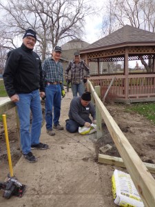 Lions worked together to place posts and guard rails on a walkway for visitors and those being trained.