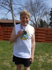 Robert after the half marathon with his medal.