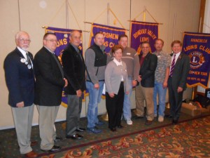 Seven new Lions join the ranks of service at 20-O luncheon.