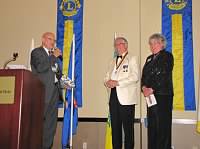 PDG Mel Olson presents ID Larry and Jane Dicus with special gifts from MD5.