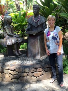Lion Kathy by a statue of a descendant of the Bishop family in a local park.