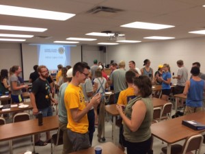 Club members welcome guests to the meeting. Nearly 20 came to the "new member information meeting."